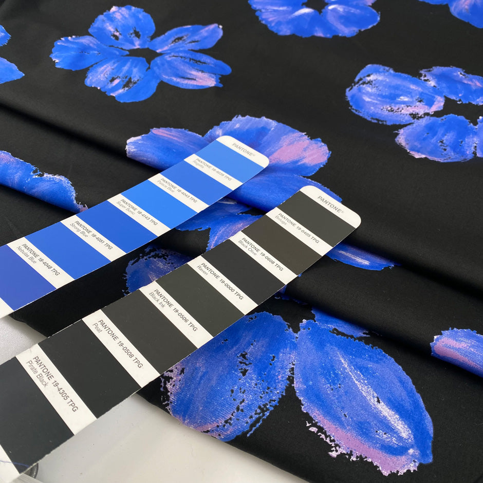 Pure cotton poplin with elastane, black base with floral print in shades of blue and pink. Very soft and not transparent. High-quality deadstock collected in Stock from a Maison de Couture in Italy. 