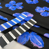 Pure cotton poplin with elastane, black base with floral print in shades of blue and pink. Very soft and not transparent. High-quality deadstock collected in Stock from a Maison de Couture in Italy. 
