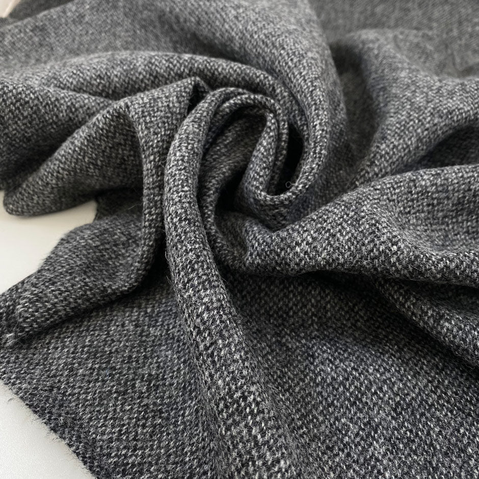 Pure wool tweed in gray melange, very soft and warm, medium weight. High-quality deadstock fabric by the meter collected in Stock from a Maison de Couture in Italy.