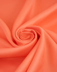 Pure viscose salmon pink cady. High-quality deadstock fabric collected in Stock from a Maison de Couture in Italy.