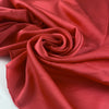 Polyester satin in coral, color reference Paradise Pink. Very soft, light and shiny, not transparent. Ideal for shirting, blouses, dresses and skirts. High-quality deadstock collected in Stock from a Maison de Couture in Italy.