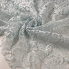 Polyester rebrodé lace in light blue very soft and light. Transparent with double scalloped. High-quality deadstock fabric by the meter collected in Stock from a Maison de Couture in Italy
