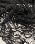 Polyester lace rebordè in black with double scalloped, soft and light. High-quality deadstock fabric collected in Stock from a Maison de Couture in Italy.