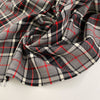 Falling and textured virgin wool tartan. High quality deadstock fabric.