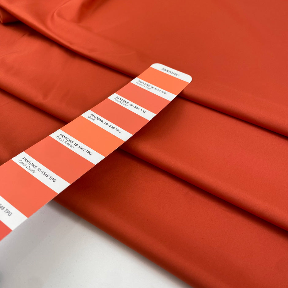 Light and soft waterproof polyester cinzato with elastane in orange, ideal for windbreakers, trenches, and light outerwear. High-quality deadstock collected in Stock from a Maison de Couture in Italy.&nbsp;