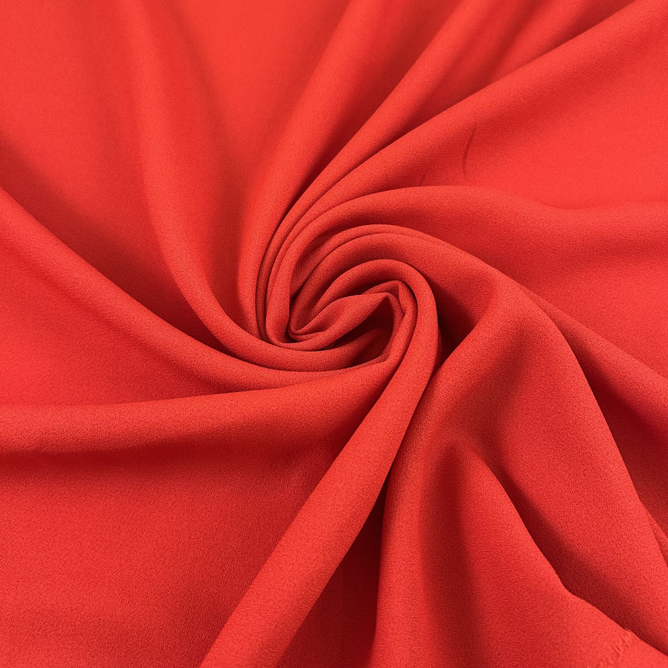 Red viscose-acetate crepe cady, soft, fluid and non-stretch. Perfect for trousers. High-quality deadstock collected in Stock from a Maison de Couture in Italy.