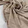 Pure cotton stretch jersey in pink beige, color reference Shell. Very soft and flowy with a slightly rough texture. High-quality deadstock collected in Stock from a Maison de Couture in Italy.