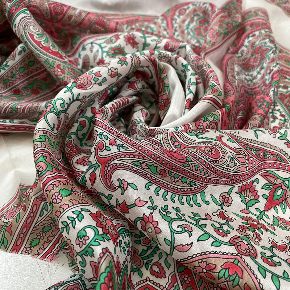 Pure silk with paisley design in panels in white, green, and pink shades. Very soft and light. High-quality deadstock fabric collected in Stock from a Maison de Couture in Italy.