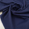 Virgin wool and silk in dark blue, with very small pied de pooule pattern in black. Very light and soft. &nbsp;High-quality deadstock fabric by the meter collected in Stock from a Maison de Couture in Italy.