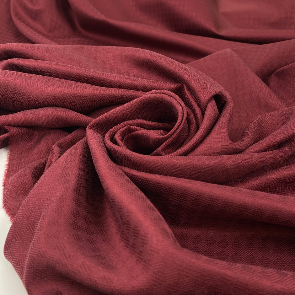 Pure soft silk twill with jacquard textured in pomegranate red.&nbsp;High-quality deadstock fabric collected in Stock from a Maison de Couture in Italy.