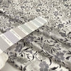 Pure silk with white ground and the flower design is in shades of gray. Very light, soft and semitrasparent. High-quality deadstock fabric collected in Stock from a Maison de Couture in Italy.