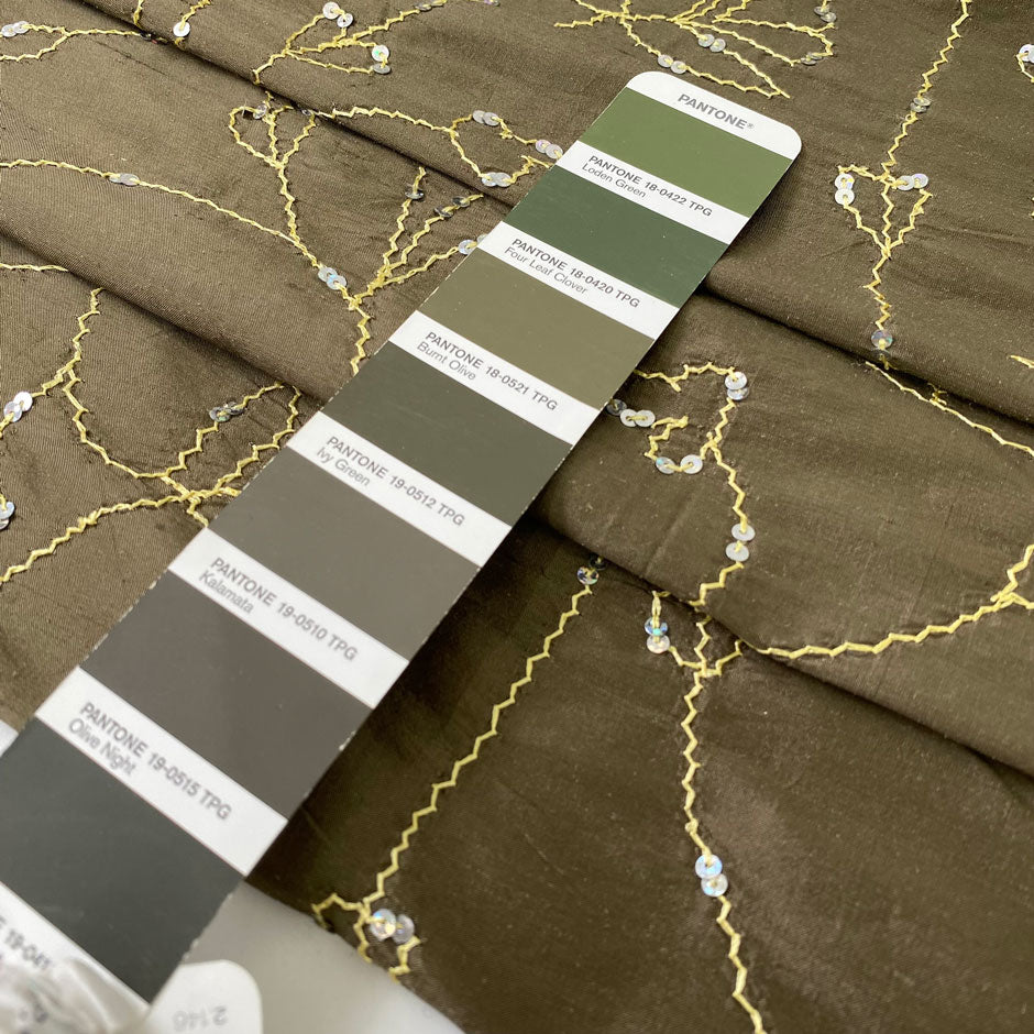 Green silk with floral embroidery and delicate sequins. Slightly stiff, it adds volume and holds shape. Perfect for jackets, dresses, and skirts.High-quality deadstock collected in Stock from a Maison de Couture in Italy.