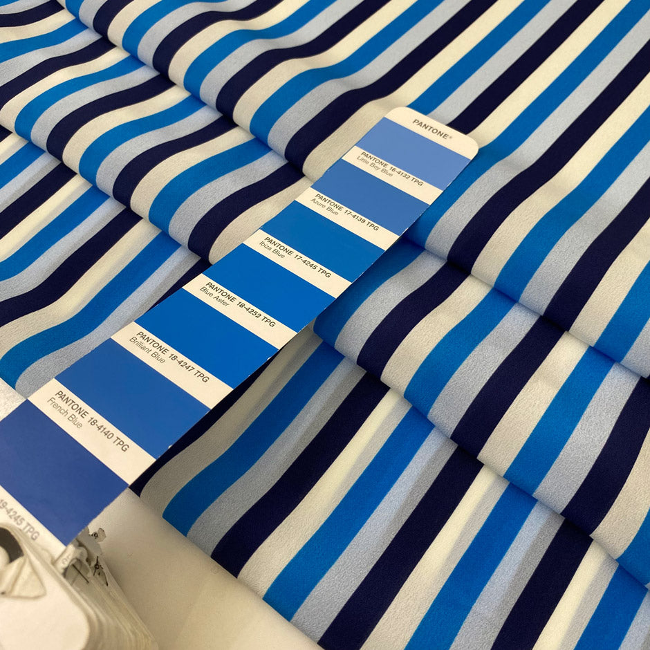 Pure silk crêpe de chine with stripe design in the shades of white, dark blue, light blue and turquoise. Very soft and light, flowy and not transparent. Ideal for dresses, skirts, blouses, and shirting. High-quality deadstock collected in Stock from a Maison de Couture in Italy.