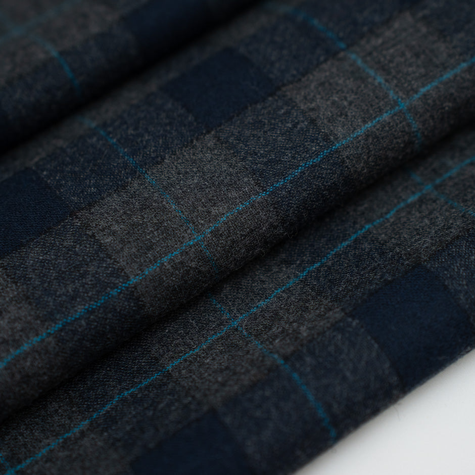Blue and gray square flannel in pure virgin wool. High-quality deadstock fabric by the meter collected in Stock from a Maison de Couture in Italy.