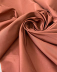 Silk and polyester blend in antique rose, matte and soft with structure. It keeps the shape while remaining voluminous. Ideal for dresses, skirts, jackets, and shirting. High-quality deadstock collected in Stock from a Maison de Couture in Italy.