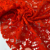 Cotton and polyester lace in tomato red with a delicate flower design, soft and light. Ideal for dresses, blouses, and skirts. High-quality deadstock collected in Stock from a Maison de Couture in Italy.