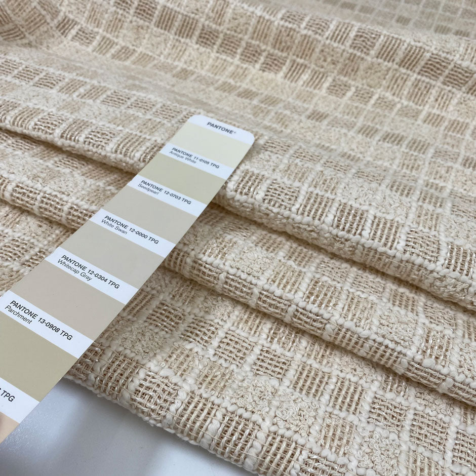 Heavy cotton tweed in vanilla white with check pattern and booklet texture. Very soft and structured, ideal for jackets, coats, and skirts. High-quality deadstock collected in Stock from a Maison de Couture in Italy.