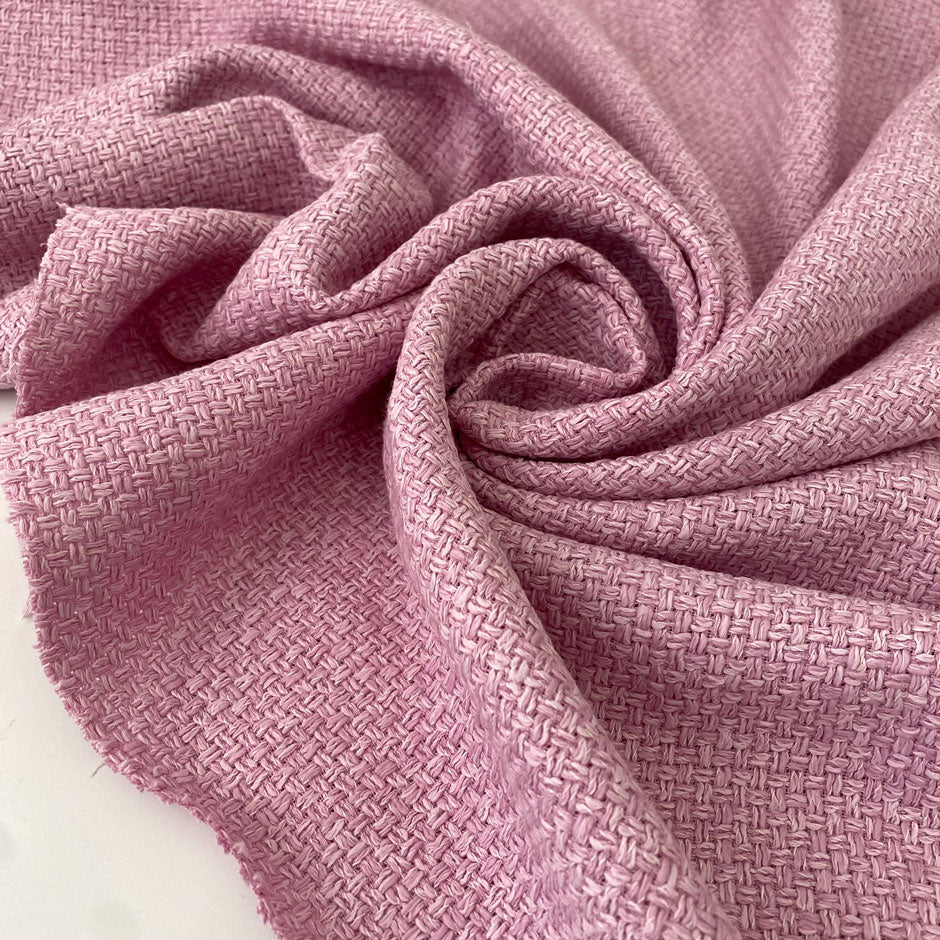 Cotton and viscose tweed in pink color, reference Pink Lavender. Very soft and light, ideal for jackets, dresses, skirts, and outerwear. High-quality deadstock collected in Stock from a Maison de Couture in Italy.