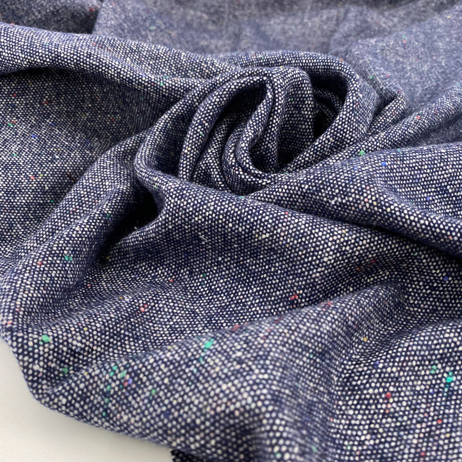 Mixed wool tweed in the shade of blue. High quality deadstock fabric.