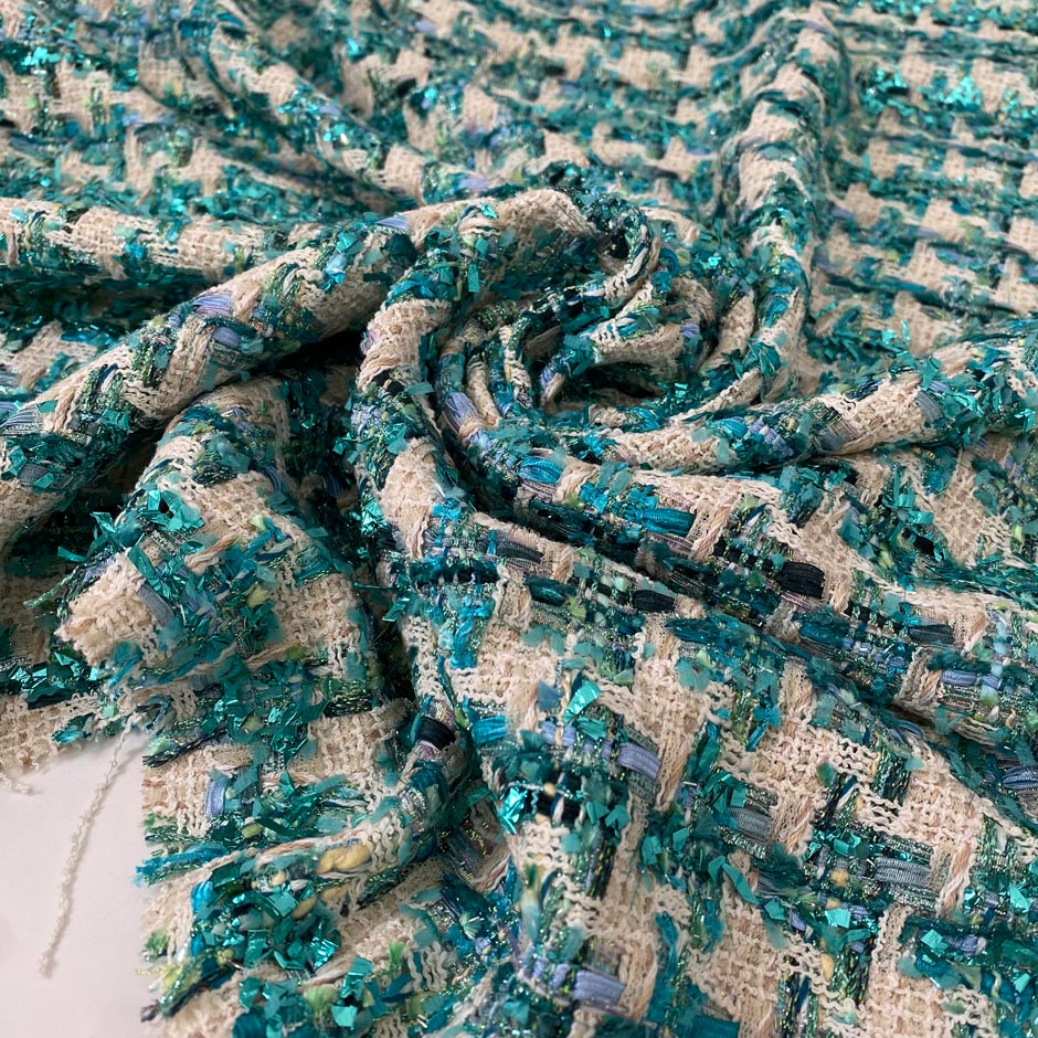Soft cotton and lurex tweed with an ivory base and turquoise lurex accents in a pied de poule texture. Ideal for jackets, light coats, skirts, and dresses.High-quality deadstock collected in Stock from a Maison de Couture in Italy.