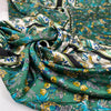 Polyester satin with floral design in panels, in white, green, and olive green shades. Very soft, light, and flowy. High-quality deadstock collected in Stock from a Maison de Couture in Italy.