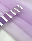 Lilac polyester organza very light and transparent, soft and flowy. High-quality deadstock fabric collected in Stock from a Maison de Couture in Italy.