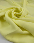 Polyester ligh cady in very bright yellow, very soft, flowy, not transparent. High-quality deadstock fabric collected in Stock from a Maison de Couture in Italy.