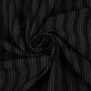 Fabric in black chalk stripe with fine white lines, elegant and slightly structured. Ideal for tailoring, trousers, jackets and skirts. High-quality deadstock collected in Stock from a Maison de Couture in Italy.