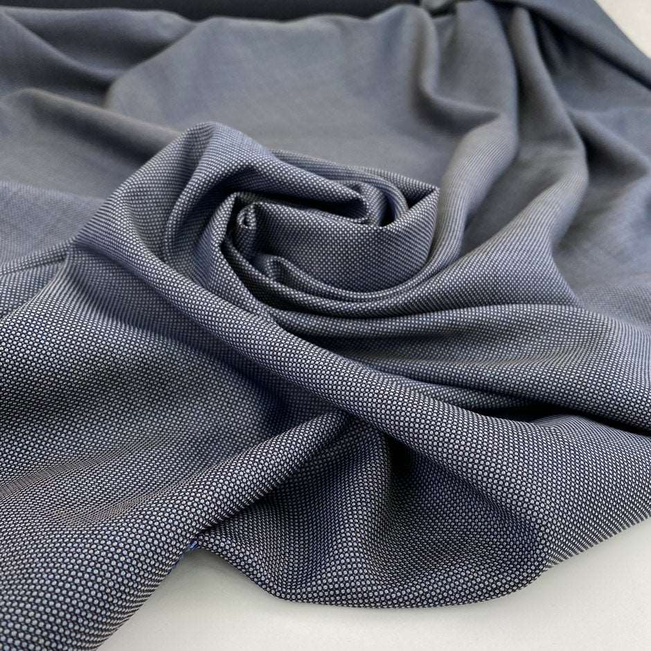 Soft and light pure virgin wool with blue and white wires. High-quality deadstock fabric collected in Stock from a Maison de Couture in Italy.