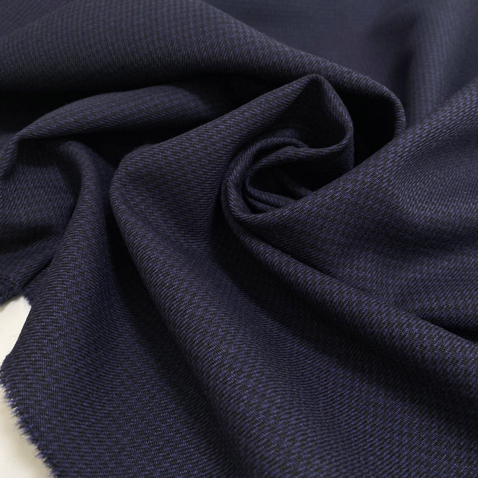 Pure virgin wool in dark blue with a tiny pied de poule pattern. Slightly stiff, perfect for structured jackets and skirts.High-quality deadstock collected in Stock from a Maison de Couture in Italy.