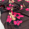 Pure viscose jersey bi-stretch, soft, light and flowy. Fuchsia floral design with brown background. High-quality deadstock fabric collected in Stock from a Maison de Couture in Italy.