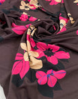 Pure viscose jersey bi-stretch, soft, light and flowy. Fuchsia floral design with brown background. High-quality deadstock fabric collected in Stock from a Maison de Couture in Italy.