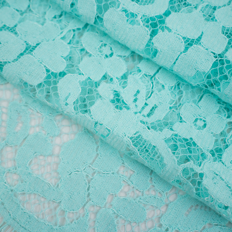 Light blue water lace polyamide and viscose. Transparent and falling. High-quality deadstock fabric collected in Stock from a Maison de Couture in Italy.