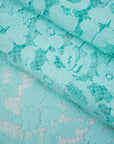 Light blue water lace polyamide and viscose. Transparent and falling. High-quality deadstock fabric collected in Stock from a Maison de Couture in Italy.