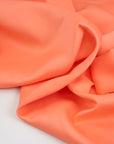 Pure viscose salmon pink cady. High-quality deadstock fabric collected in Stock from a Maison de Couture in Italy.