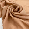 Pure viscose very soft and flowy in almost apricot pink. Ideal for shirts, skirts, dresses, and blouses. High-quality deadstock fabric by the meter collected in Stock from a Maison de Couture in Italy.
