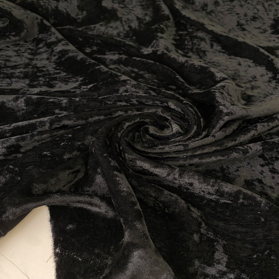 Shiny black velvet in a viscose and polyester blend. Very soft, light, and flowy, yet not transparent. Ideal for dresses, trousers, and skirts. High-quality deadstock collected in Stock from a Maison de Couture in Italy.