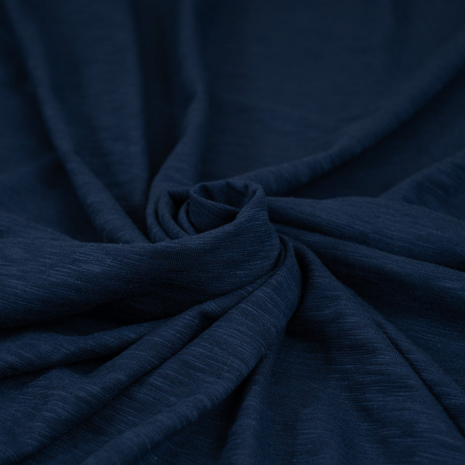 Stretchy and transparent blue pure cotton jersey. High-quality deadstock fabric collected in Stock from a Maison de Couture in Italy.