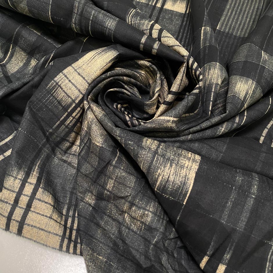 Soft and lightweight pure cotton with a geometric design in shades of gray and black. Not transparent, ideal for dresses, blouses, skirts, and shirting.High-quality deadstock collected in Stock from a Maison de Couture in Italy.