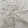 Pure cotton in bright white with geometric square embroidery. Very soft, light, and slightly transparent. Perfect for shirting, dresses, and skirts. High-quality deadstock collected in Stock from a Maison de Couture in Italy.
