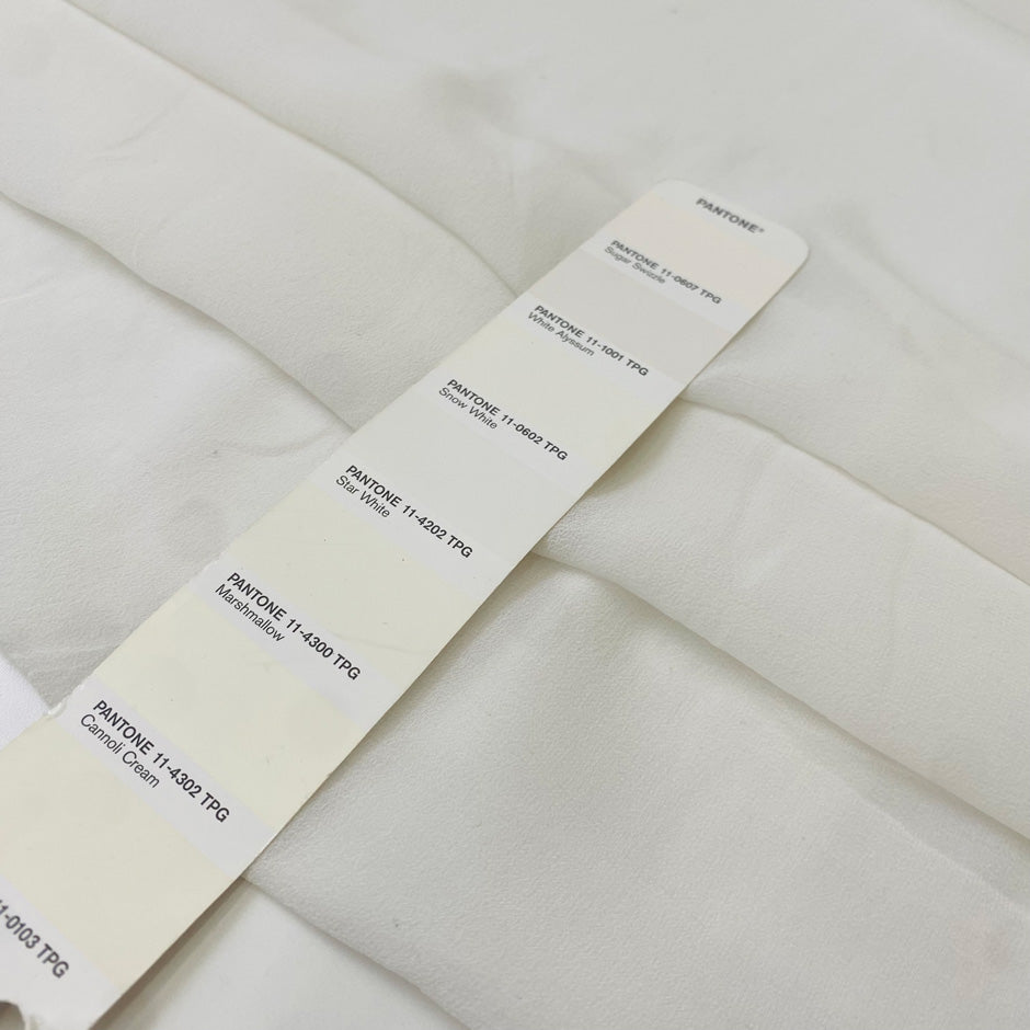 Pure silk georgette in white, color reference Star White. Very soft, light, transparent, and flowy—ideal for dresses, skirts, blouses, and shirting. High-quality deadstock collected in Stock from a Maison de Couture in Italy.