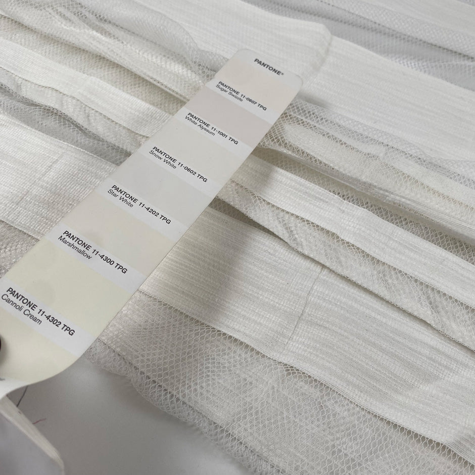Jacquard net in cotton and polyester with striped design, in star white color. Very light and soft, transparent. Ideal for dresses, skirts, shirting, and blouses. High-quality deadstock collected in Stock from a Maison de Couture in Italy.