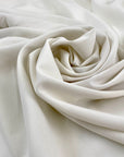 Polyester-like cady in white, very soft, light, and flowy. High-quality deadstock fabric collected in Stock from a Maison de Couture in Italy.