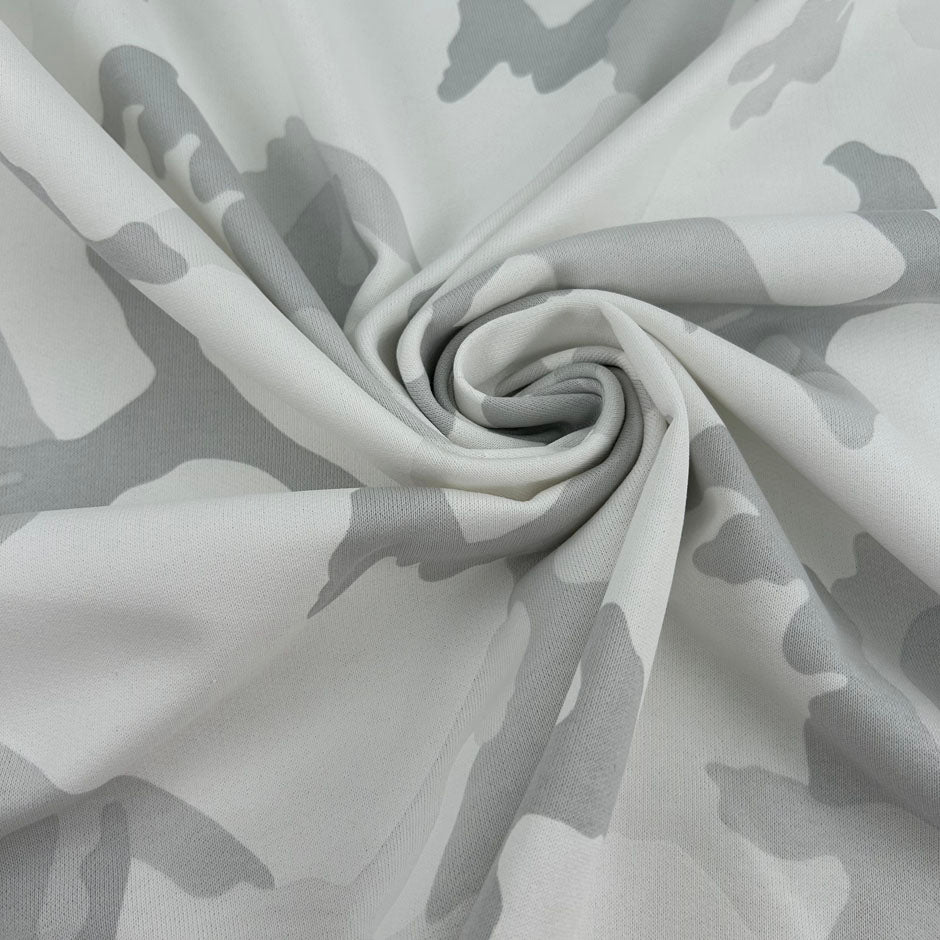 White pure cotton French terry with camouflage print, soft and non-stretch. High-quality deadstock collected in Stock from a Maison de Couture in Italy.