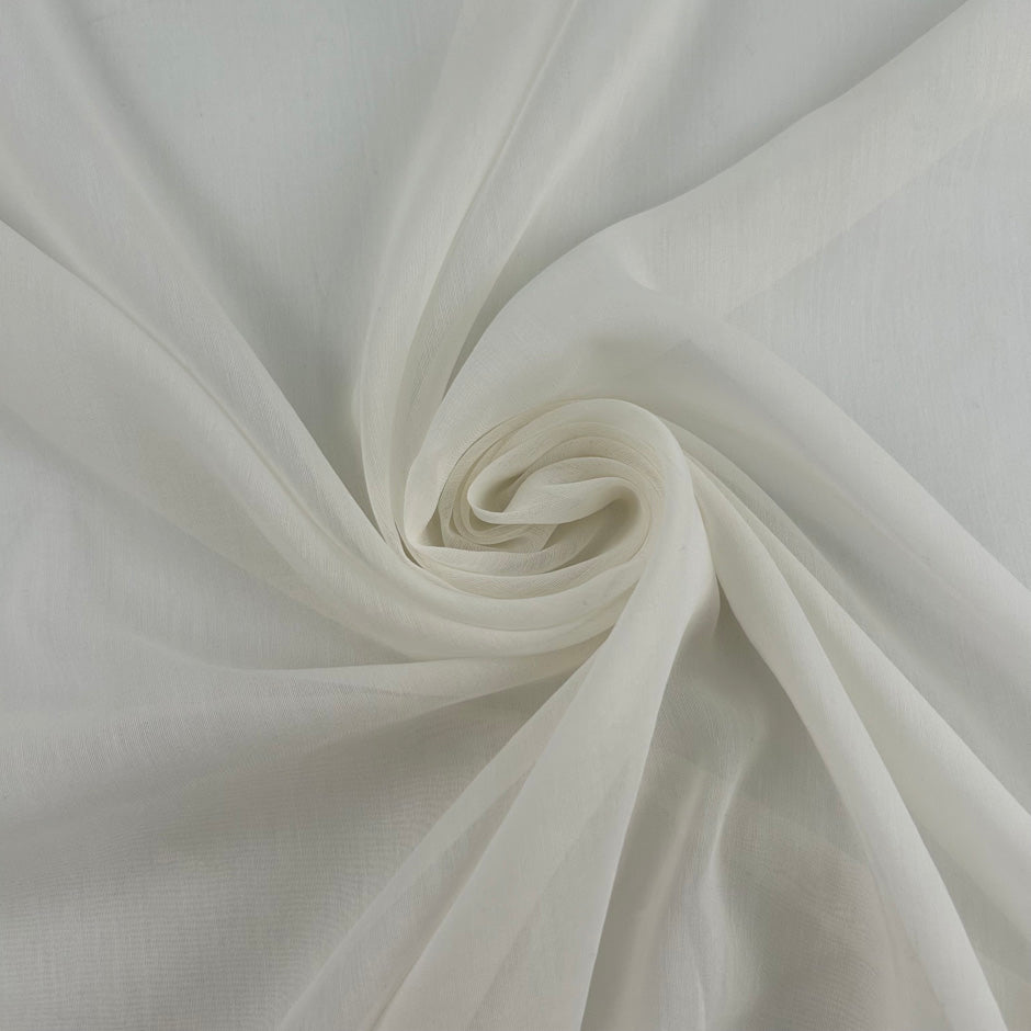 White silk and cotton voile, soft, transparent and non-stretch. High-quality deadstock collected in Stock from a Maison de Couture in Italy.