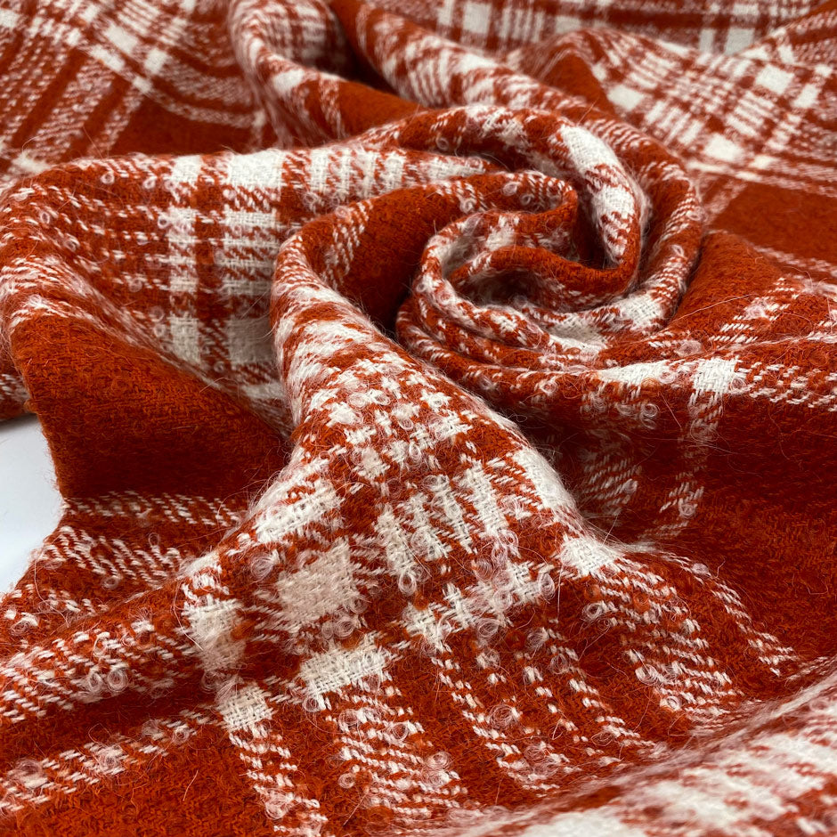 Soft checkered mixed wool tweed in orange and white. High quality deadstock fabric.