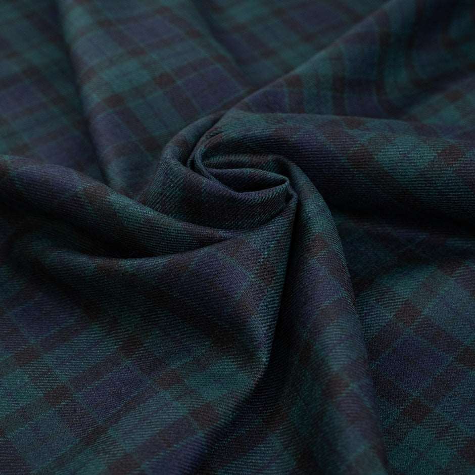 Dark and falling pure watch wool tartan. High-quality deadstock fabric collected in Stock from a Maison de Couture in Italy.