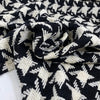 Pure wool with pied de poule design in black and white, color reference Pirate Black and Marshmallow. Heavy and structured, ideal for coats and jackets. High-quality deadstock collected in Stock from a Maison de Couture in Italy.