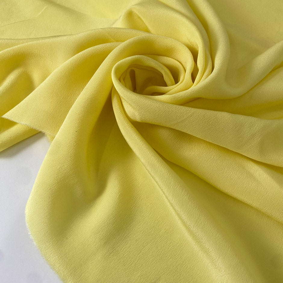 Light and soft yellow silk crêpe de chine with a fluid drape and slight transparency. Perfect for dresses, blouses, skirts, and shirting.
High-quality deadstock collected in Stock from a Maison de Couture in Italy.
