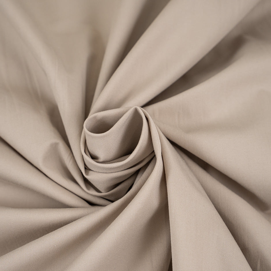 Stretch beige cotton stiff fabric. High-quality deadstock fabric collected in Stock from a Maison de Couture in Italy.